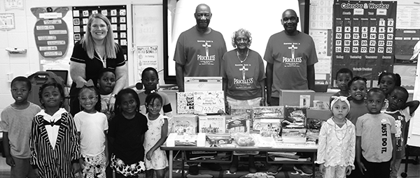Pastor William E. Scott and Macedonia Church members pose with Ms. Huff's class and Miss Atkins' class.