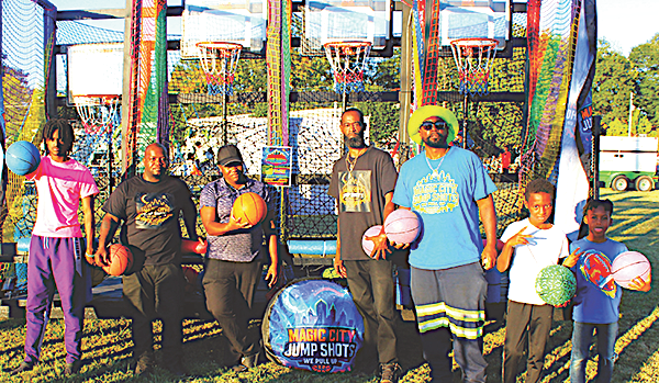 Magic City Hoop staff poses with kids