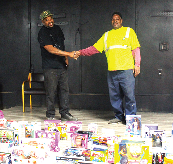 Mr. Mayweather and Lee E. Davis are shown during their Christmas toy drive held
in Bessemer.