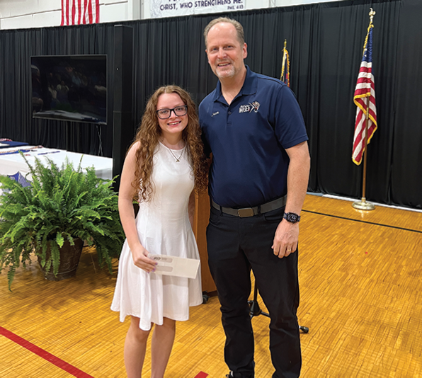 Mary Alexis Price of Bessemer Acadmy is presented the Maxine Sykes Vocational
Education Scholarship by Jason Jewell recently.