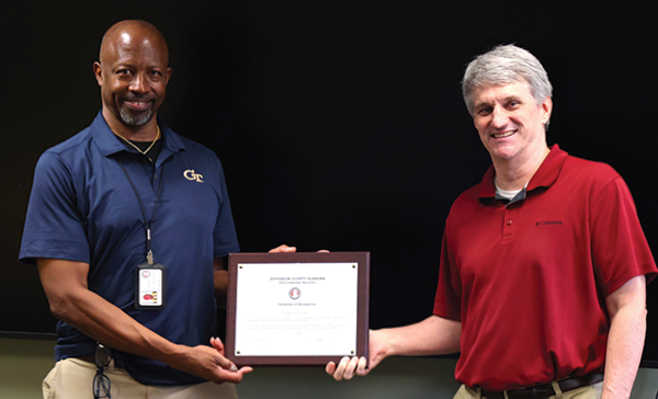 Mr. Hayden receiving certificate of recognition
