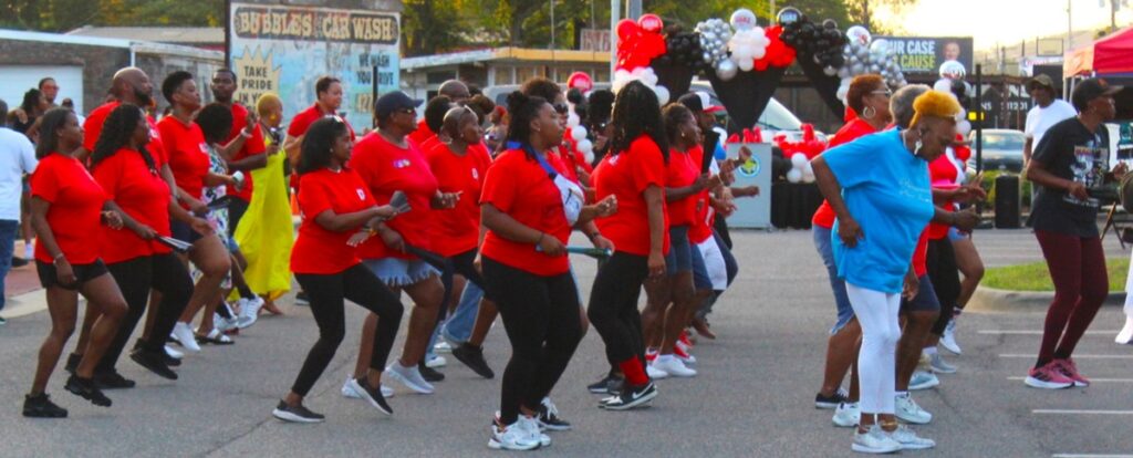 Line dancing outside the center