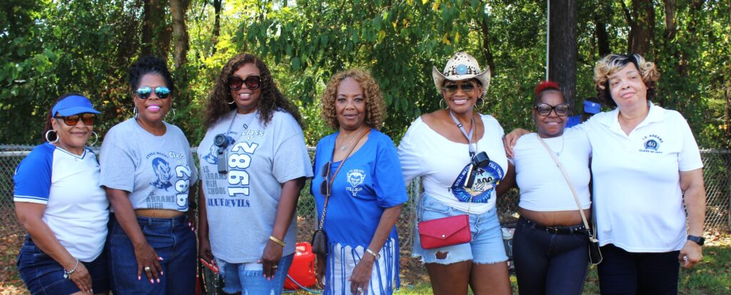 Alumni in Class of 1982 shirts at the class day.