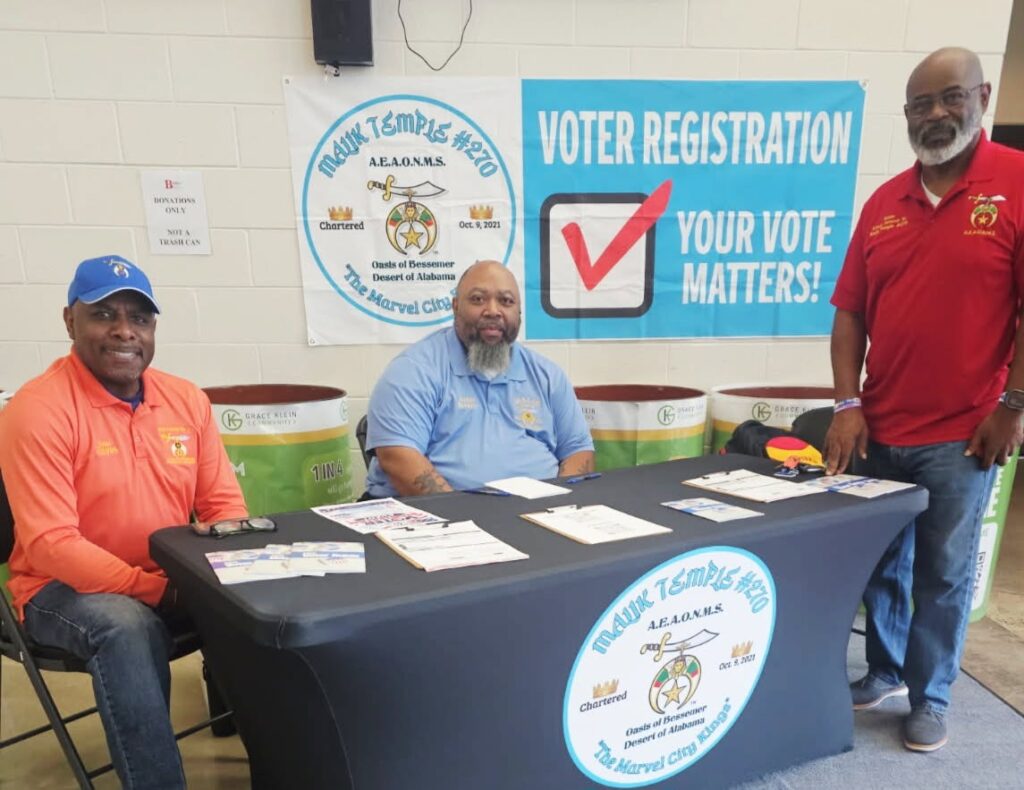 Members of Malik Temple #270 with voter registration forms at the temple's registration table