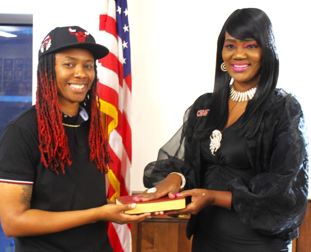 Elaine Holifield, newly elected to the Bessemer Board of Education, and her daughter Bianca share a light moment at the swearing-in.Elaine Holifield, newly elected to the Bessemer Board of Education, and her daughter Bianca share a light moment at the swearing-in.