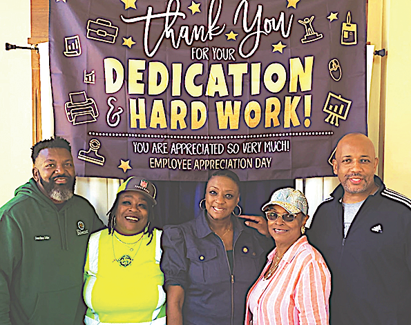 Council members pose with city employees