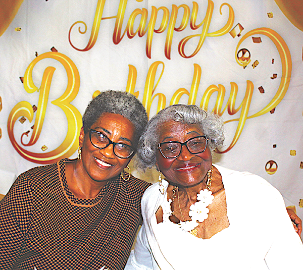 Ms. Vinson and Ms. Scott share birthday smiles