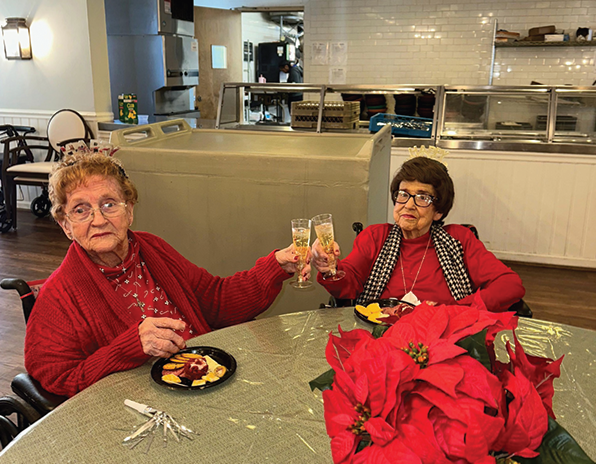 Ella Hill and Eloise Davis at Plantation Manor toasting the New Year