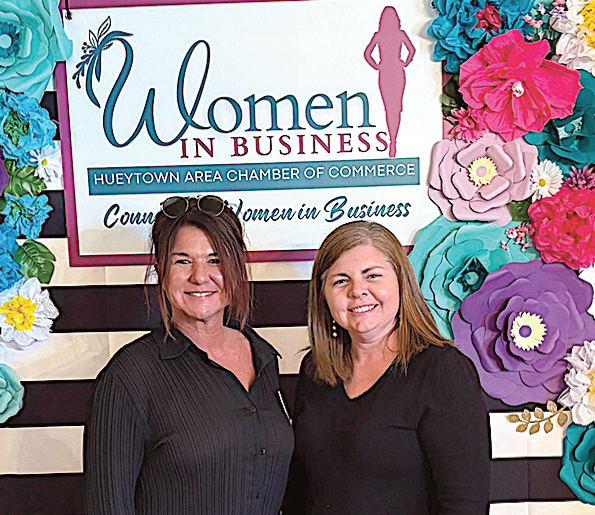 Sharon Bradshaw and Stephens Smith with Reliable Signs Co.