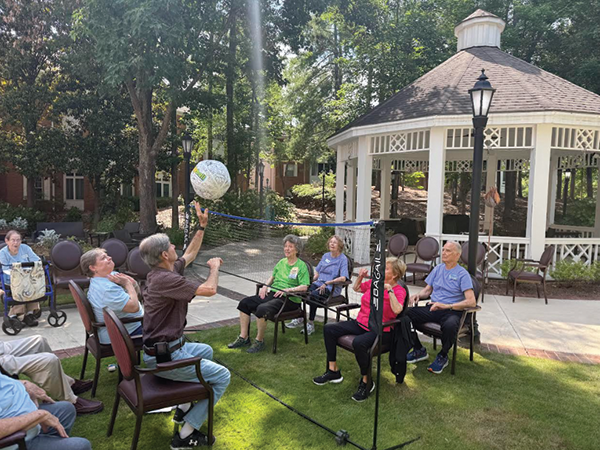 Residents competing in chair volleyball