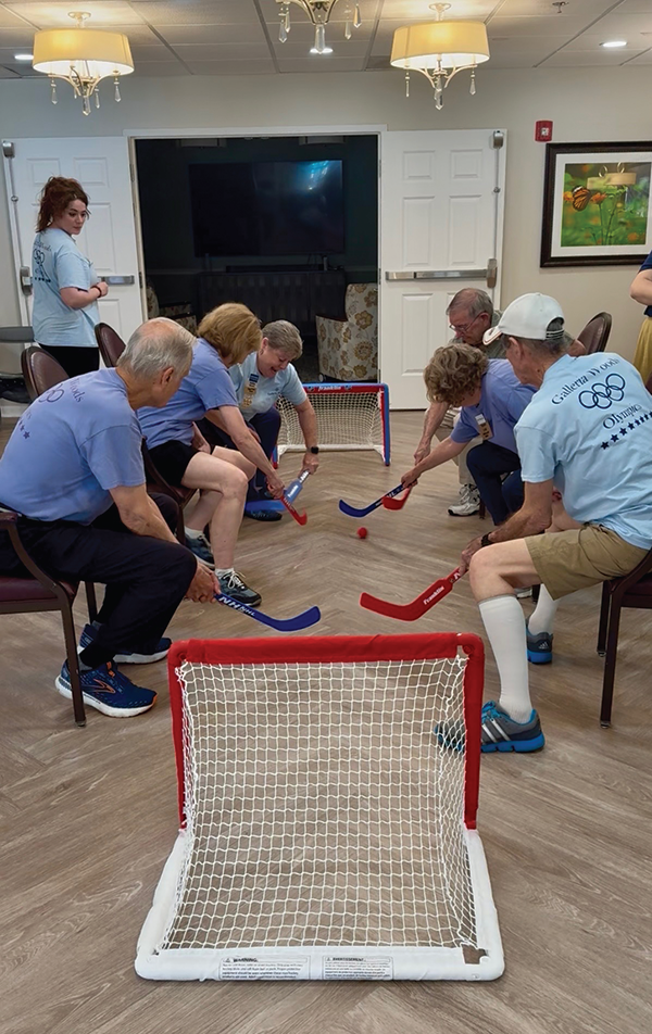 Participants showing off their skills in chair hockey