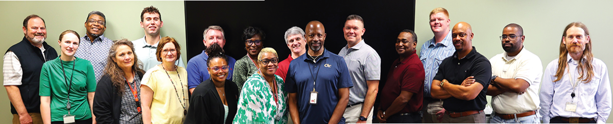 Coworkers surround Mr. Hayden with smiles
