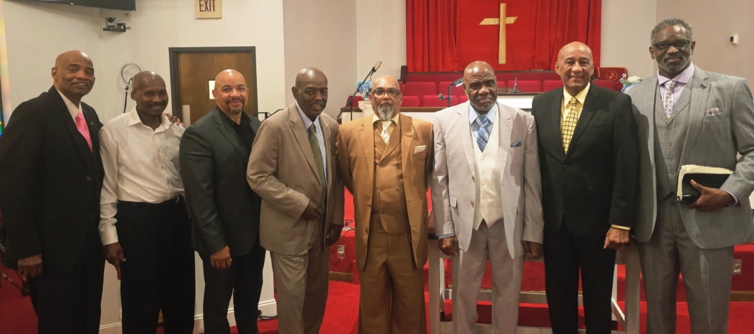 Pastors Jeffery Alexander and Earl A. Caruthers Sr. with co-pastors and members during recent services.