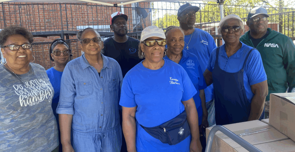 Shelia Rice, from left, Kayatta Evans, First Lady Lola Burgines, Barbara Burton, Bettye Taylor, Belinda Johnson, Earnest Alexander, Clarence Alexander and James Spraggins at Greater 14th Street Baptist Church’s food box giveaway Saturday.